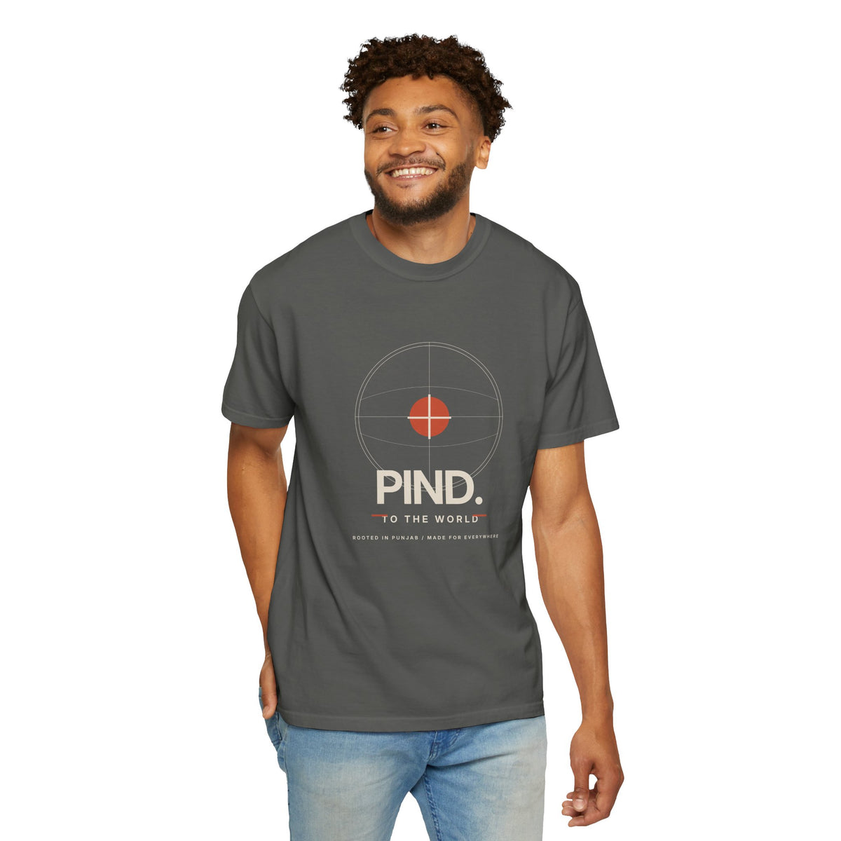 PIND. TO THE WORLD. minimalist Punjabi heritage tee with a circular red-centre graphic and simple lettering.