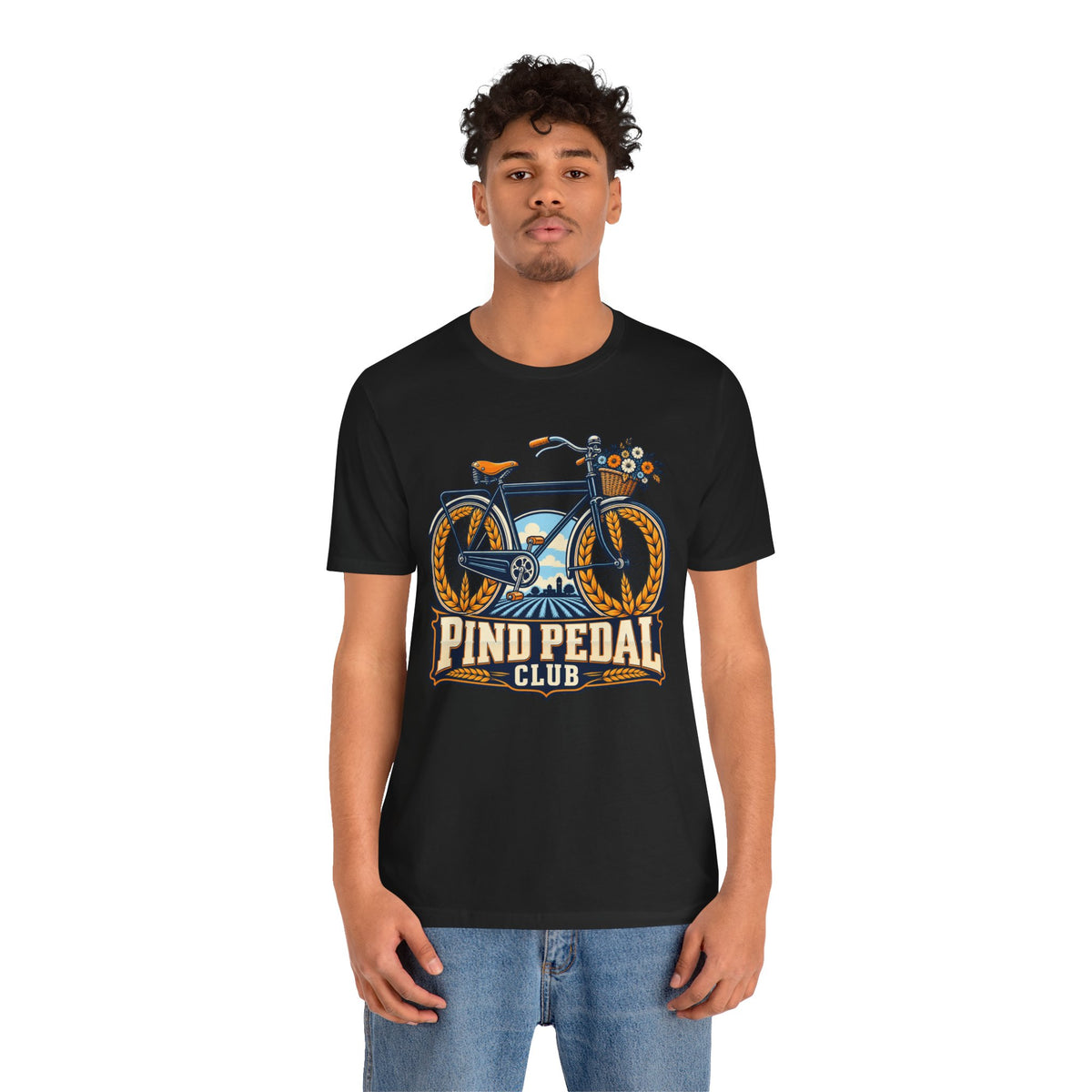 Pind Pedal Club T-shirt graphic with a bicycle, wheat-framed wheels, flower basket and vintage badge.